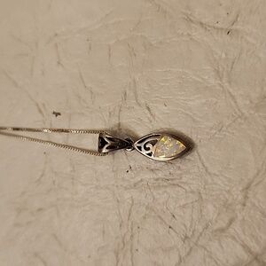 Opal stimulant charm in .925 setting